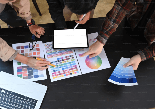 three people looking at different colors for design